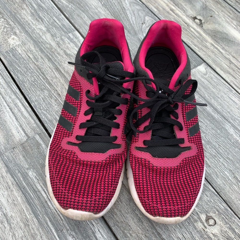 Adidas pink and back shoes